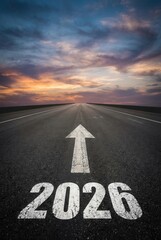 Road Ahead to Year 2026 with Arrow on Asphalt at Sunset.