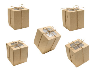 Few various brown paper boxes with transparent window on lid tied with twine at various angles on...