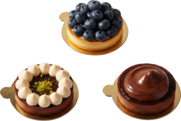 Three Delicious Pastries Featuring Fresh Blueberries Creamy Chocolate and Nut Toppings Arranged on Gold Discs for a Tempting Dessert Display desserts sweet