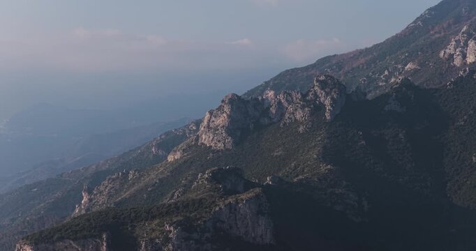 Aerial view of rugged mountains and green forests, showcasing the natural beauty, Erchie, Amalfi Coast, Italy.