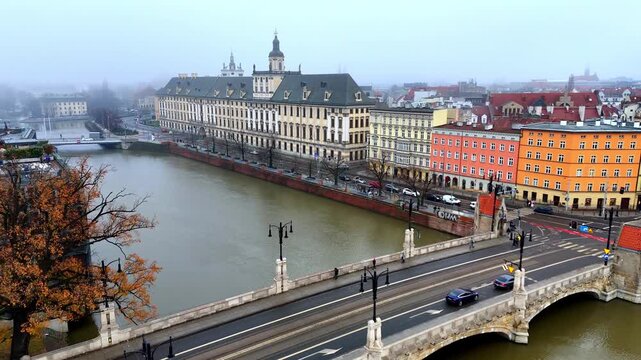 Wroclaw panorama over Oder River with Pomorski Bridge and Wroclaw University, autumn mist, historic city architecture