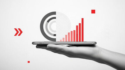 Hand holding tablet with red graph and arrow on screen