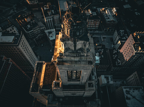 Aerial view of a dramatic contrast of light and shadow across the Industrial Trust Building, its architectural details casting long shadows, Providence, Rhode Island, United States.