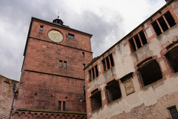 Heidelberg Castle Clock Tower and Ruins.The clock tower of the historic Heidelberg Castle and castle ruins.
