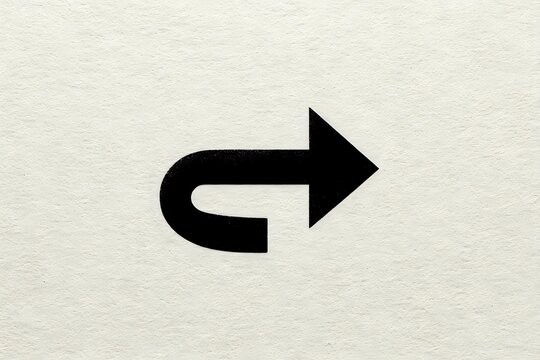 Black curved arrow pointing right on textured beige paper background, useful for navigation icons or direction indicators.