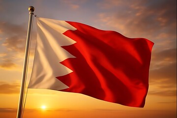 Waving national flag of bahrain against a dramatic sunset backdrop