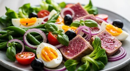 Classic Nicoise Salad with Seared Tuna Green Beans Eggs Tomatoes and Olives Served on Plate Fresh and Colorful Mediterranean Cuisine Healthy Gourmet Dish