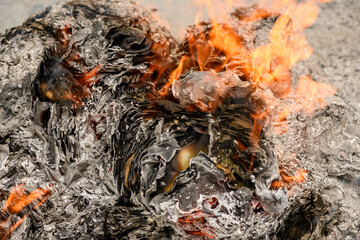Burning accounting documents turning into ash and flames