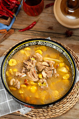 Asian Chicken Chestnut Soup in Decorative Bowl on Wooden Table