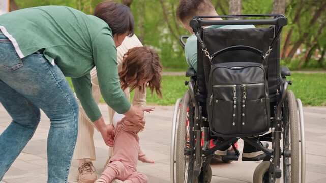 Little One Moves With Gentle Aid Nearby, Young Child Steps Forward With Compassionate Support Nearby, Toddler Progresses Forward As Kind Friends Provide Encouraging And Gentle Assistance