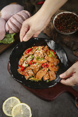 Spicy Chinese Pork Stir-Fry with Fresh Chilies and Sesame Seeds