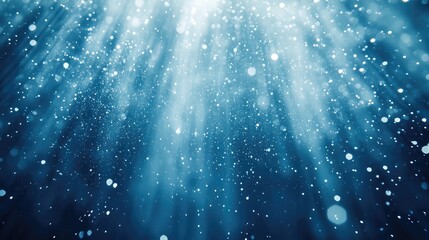 Naklejka na ściany i meble Shimmering ethereal particles and soft light rays create a dreamy blue bokeh backdrop, evoking festive winter sparkle, glowing dust and magical frozen atmosphere