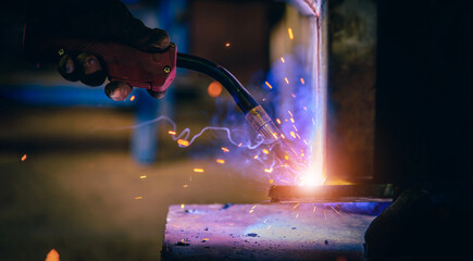Welding steel structures and bright sparks in steel construction industry.