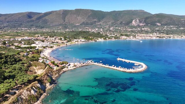 Aerial drone cinematic video of famous seaside village of Alykes featuring popular resort beach of Alykanas in northern part of Zakynthos island, Ionian, Greece