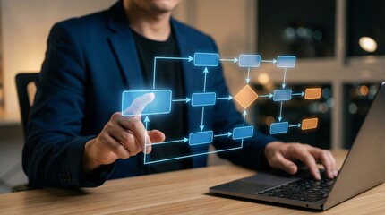 Businessman touching virtual flowchart interface while using laptop,managing digital workflows and algorithm logic,optimizing business process automation for strategic efficiency.