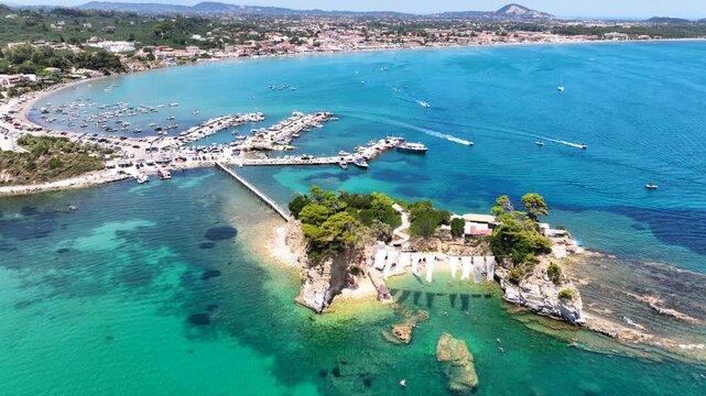 Aerial drone cinematic video of scenic small islet and sandy beach of Cameo in bay of Laganas, Zakinthos island, Ionian, Greece