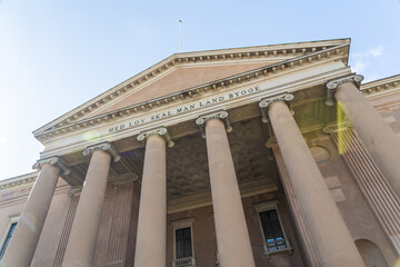 View of grand courthouse facade, the imposing columns and triangular pediment stand out against the blue sky, a symbol of justice, Indre By, Copenhagen, Denmark.