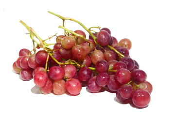 A bunch of juicy, ripe red grapes on the vine