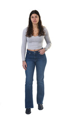 Obraz premium front view portrait of an 18-year-old girl standing, looking at the camera and serious and hand on pocket on white background