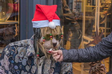 Lion puppet lights his cigarette
