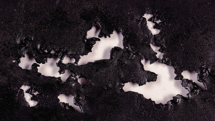 background of rusty old metal covered with black paint and decor