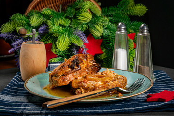 Two pieces of pork stewed in onion.