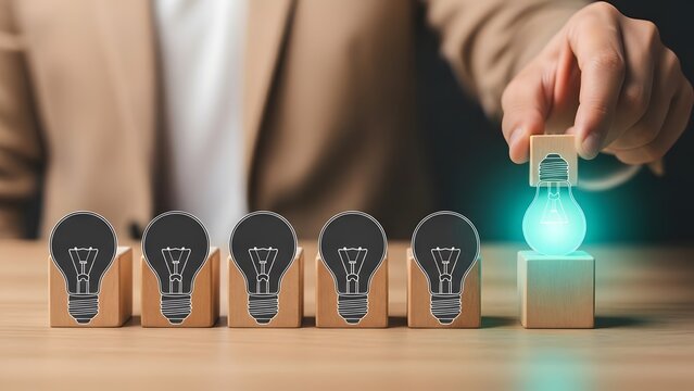 Businessman selecting the best glowing idea from multiple lightbulb concepts