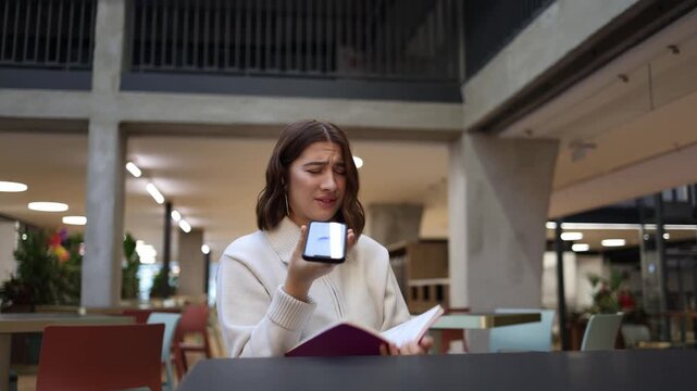 Artificial intelligence gives an incorrect response as young professional woman feels frustrated reviewing notes in cafe and realizing she must redo a work task after an AI mistake