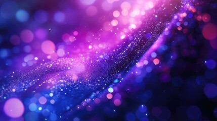 Obraz premium Abstract blue and purple particles are creating a glowing bokeh background with a dynamic flowing effect, offering a vibrant backdrop for various digital design concepts
