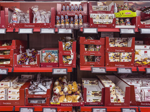 LIDL Christmas seasonal confectionery and small plush toys arranged on supermarket shelves with price labels.