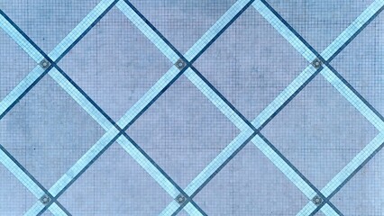 Aerial view of an intricate grid pattern of intersecting lines creating a geometric mosaic of light and shadow, Daytona Beach, Florida, United States.