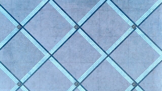 Aerial view of an intricate grid pattern of intersecting lines creating a geometric mosaic of light and shadow, Daytona Beach, Florida, United States.