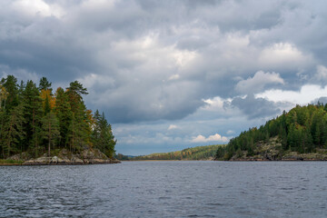 Small rocky islands in narrow bays in the Ladoga Skerries National Park near the village of Lumivaara on a sunny autumn day, Republic of Karelia, Russia