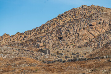 Ancient hillside ruins on Delos island archaeological site Greece