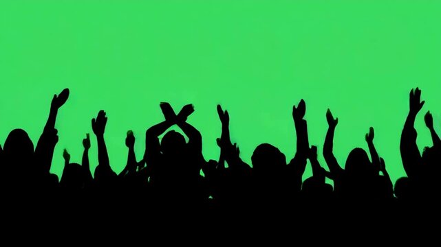 Crowd cheering on green screen. Crowd silhouette of people at a club concert or sports event. Green screen for compositing and presentation. Copy space