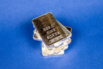 Fine Silver Bars stack on blue banner, gold and silver trade concept