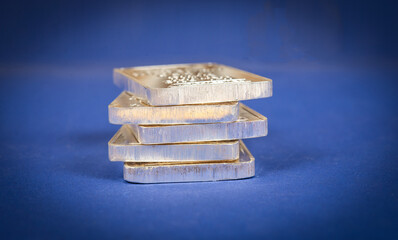 View of precious metal silver bars on blue banner