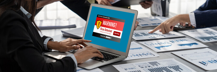 Virus warning alert on computer screen detected brisk cyber threat , hacker, computer virus and malware