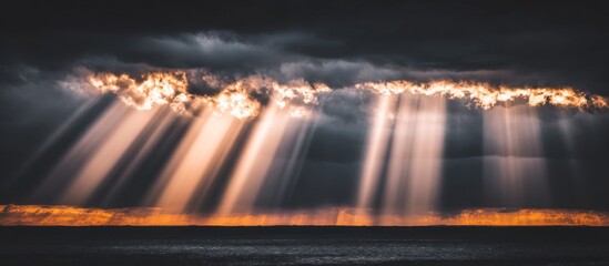 Dramatic Sunbeams Breaking Through Stormy Clouds Over Water.