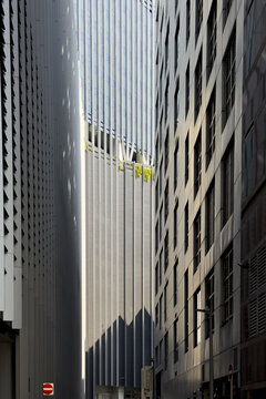 View of towering skyscrapers rise in a symphony of steel and glass, their sleek facades reflecting the sky's gentle light in Kuala Lumpur, Federal Territory of Kuala Lumpur, Malaysia.