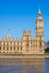 Naklejka premium London, England, UK: Waterfront view of the Big Ben tower and the House of Parliament building on the banks of river Thanes