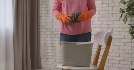 Woman Preparing for House Cleaning with Mop and Bucket