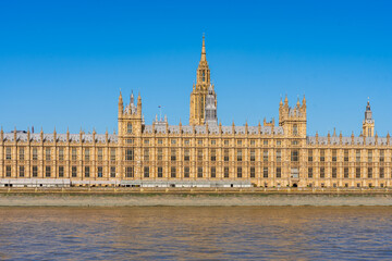 London, England, UK: Waterfront view of the House of Parliament building on the banks of river...