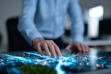 A businessman in a button-up shirt interacts with a futuristic digital map projection, highlighting urban development, analytics, and modern technological advancements in business.