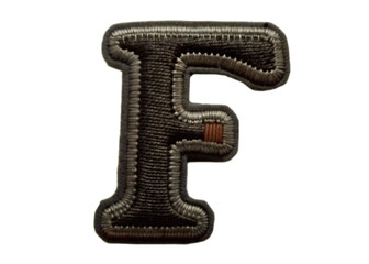 3d metallic letter f with textured surface isolated on white background