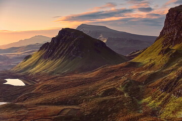 Trotternish ridge, land-slipped mass of Cleat at the foot of Bioda Buidhe summit seen from Quiraing at a colorful, beautiful dawn. Skye-Scotland-166