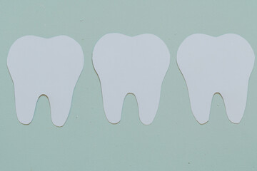 White teeth on a blue background. Flat view, top view, space for text. 