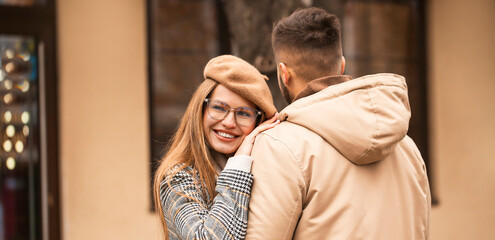 Portrait of happy young couple walking outdoors