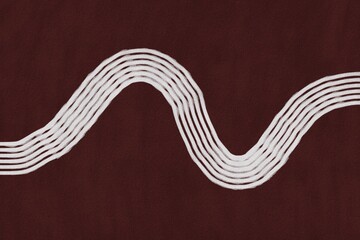 Curved white lines create a wave pattern over a dark red background