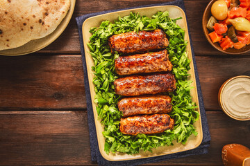 Tarb is a middle Eastern dish that combines minced meat, onions and various spices. It wrapped in a layer of lamb fat and grilled to a golden brown color. It's one of the most popular dishes in Egypt.